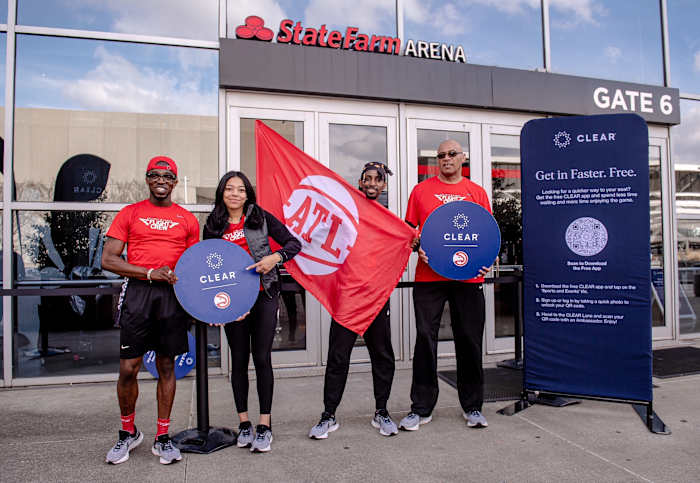 Volunteers posing outside of Hawks game.